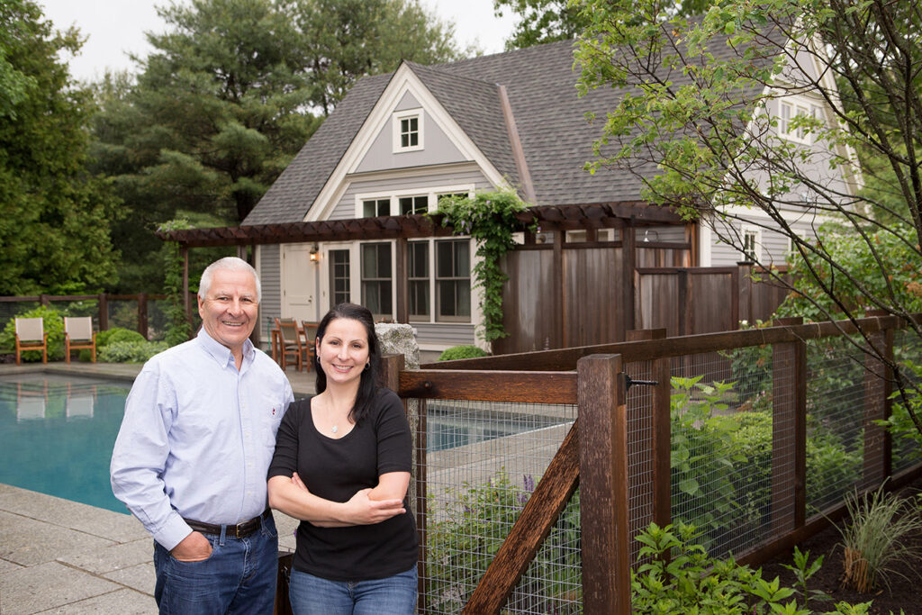 Kate and her dad Arthur standing outside one of their project exteriors