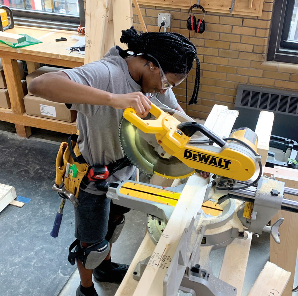 Student using a chop saw