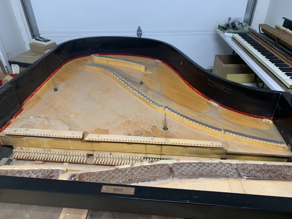 Grand piano being restored by Peter Critchley when he was a student