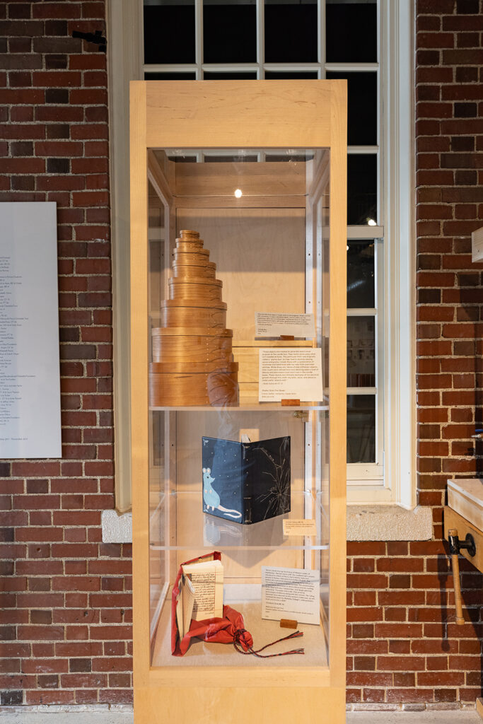 Shaker boxes and candle box by Kolin Schmidt CF ’21 and books by Jennifer Pyburn BB ’24 and Elizabeth Grab BB ’24