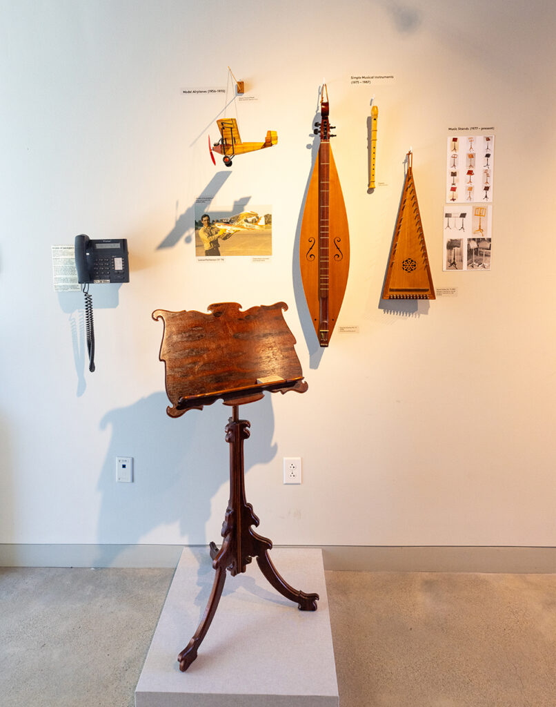 Instruments, plane model, and music stand by Cabinet & Furniture Making Instructor Lance Patterson CF ‘79