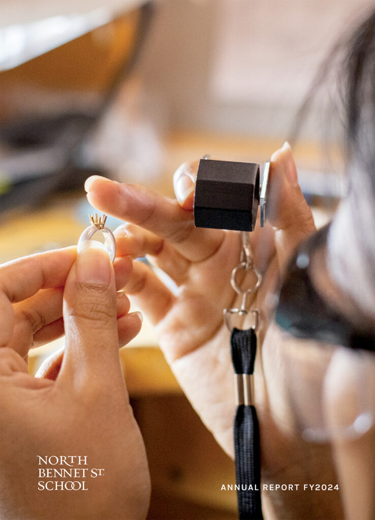 Cover of the FY24 Annual Report, showing a student measuring the prongs of a ring