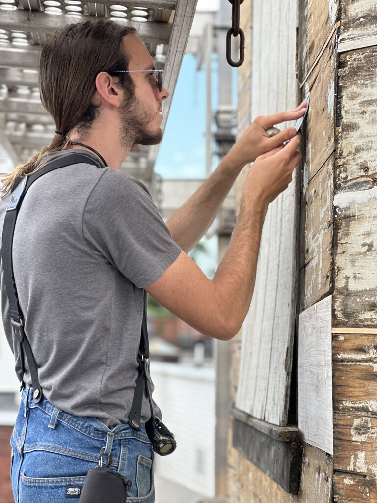 Preservation Carpentry student working on restoring the belvedere in summer 2024