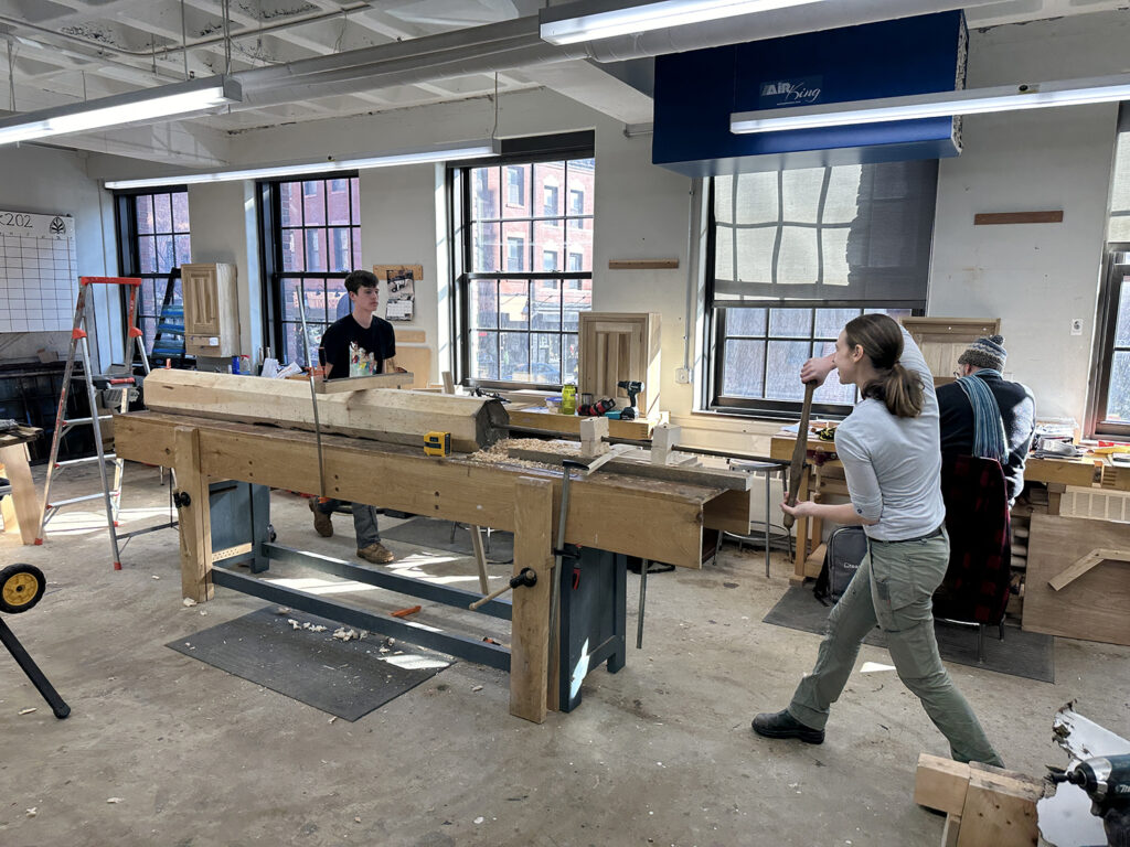 Second-year students Maya and Thomas drilling out the center of a new column