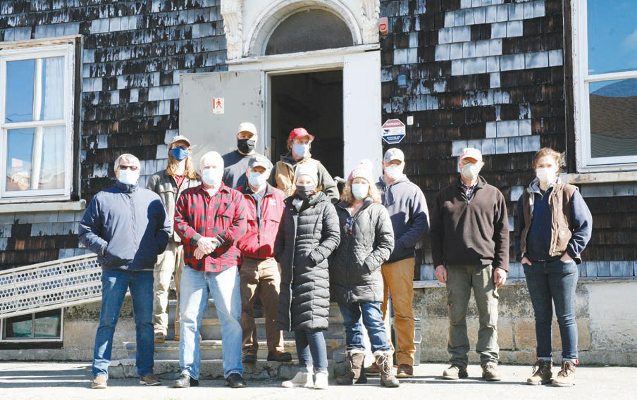 Crews from the PC program joined friends and allies of Memorial Hall in April 2021 morning to kick off the long-anticipated historic renovation of the Hall’s exterior and windows. In the front row are Hall President Joe Zuffante, Vice President Stan Leonard, Charlestown Preservation Society President Amanda Zettel and Kira Dunn, of the Friends of Memorial Hall.