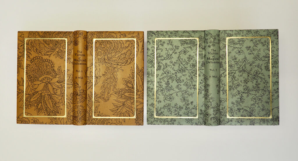 Two volume design binding set of "The Victim of Magical Delusion" by P.Will from 1795, bound by Gabby Cooksey BB ’14