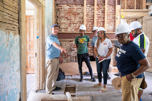 Brian explaining building construction to coworkers