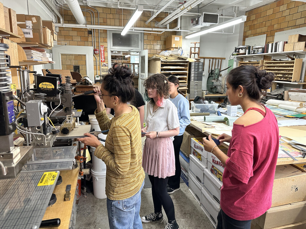 Bookbinding Teen Intensive students learning foil stamping