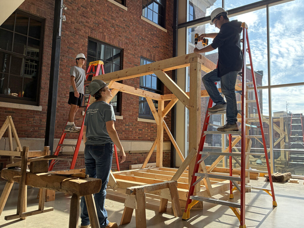 Preservation intensive students assembling the timber frame