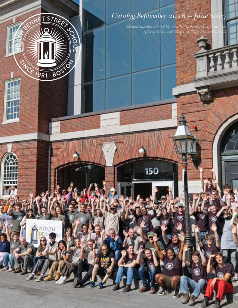 Cover of the Student Catalog showing the all school photo in front of the building