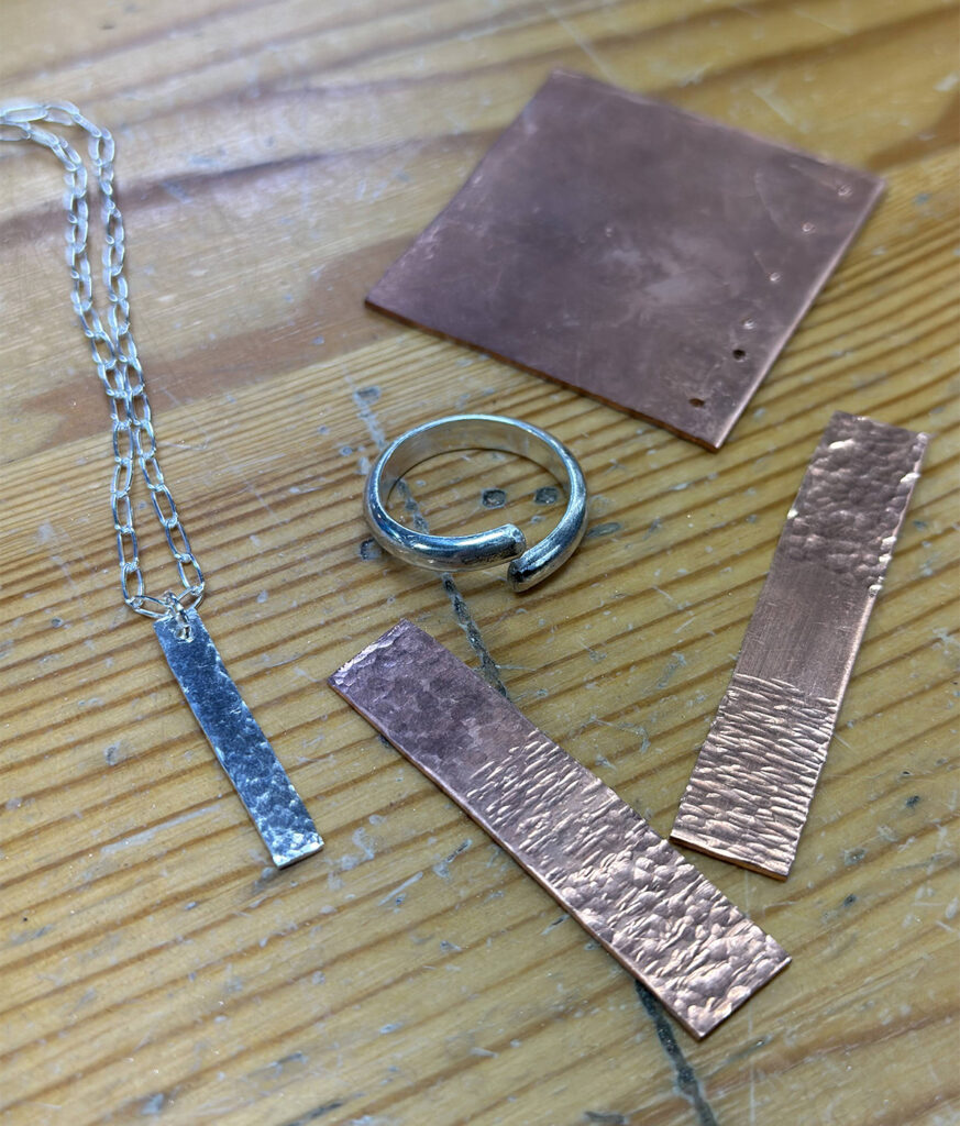 Projects made in Jewelry Making 101: hammered bar pendant, non-soldered silver ring, hammering, drilling and sawing practice plates