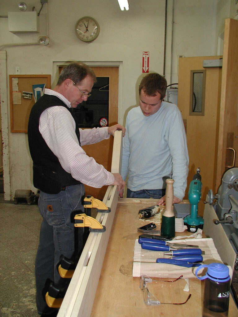Preservation Carpentry Instructor Robert Adam working with a student