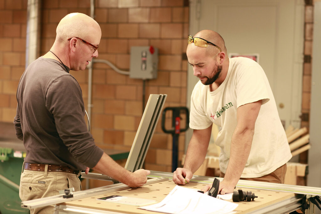 Steven O'Shaughnessy working with a student in 2014