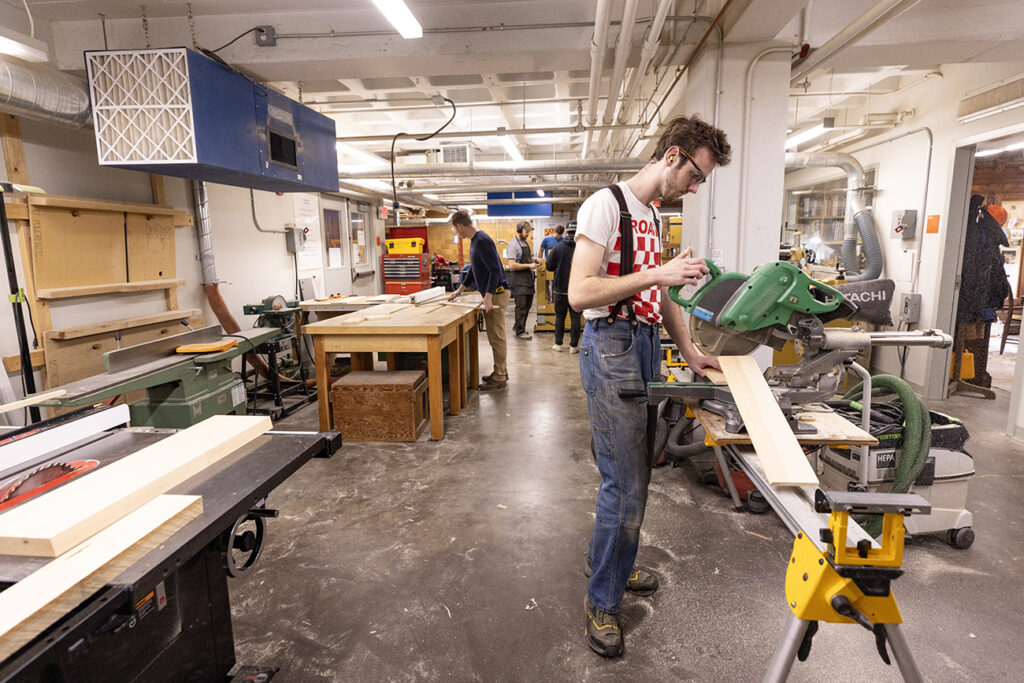 Student working in the machine room in the new building in 2025