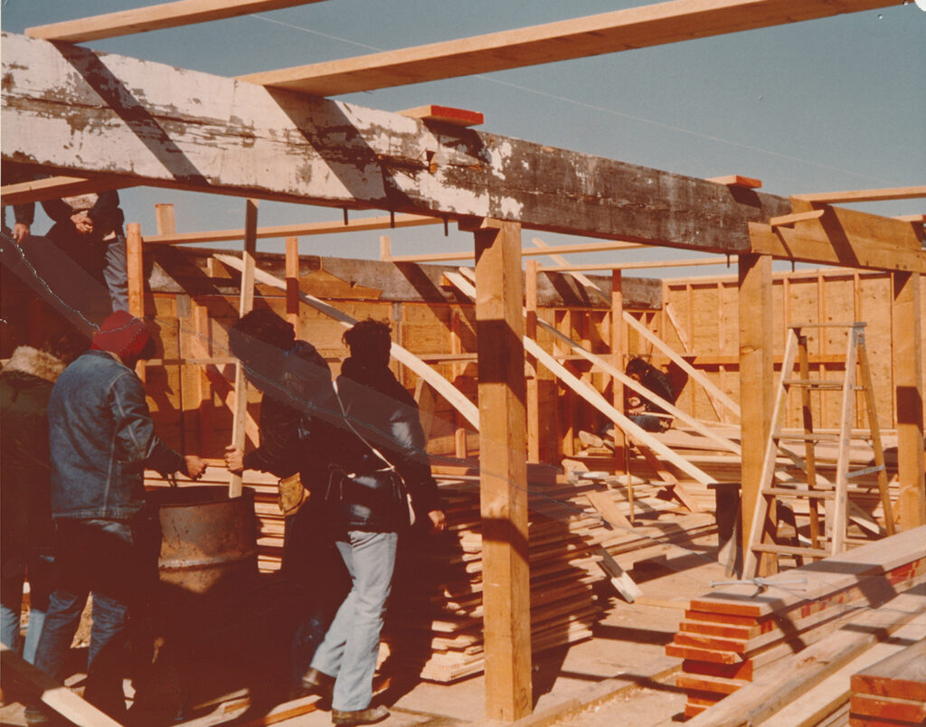 From Peter: It looks like they are repurposing or salvaging some of the large beans that didn't burn—the whitewash is still on that. They cut a scarf joint, which you can see to the left of that wooden step ladder.