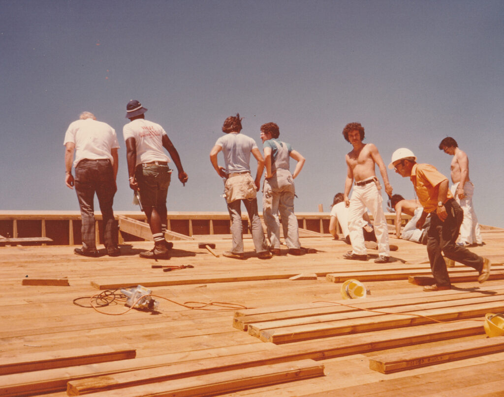 Students working on the roof, July 1977
