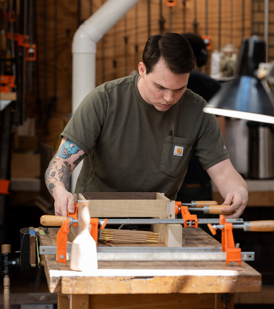 Woodworking student working on a drawer