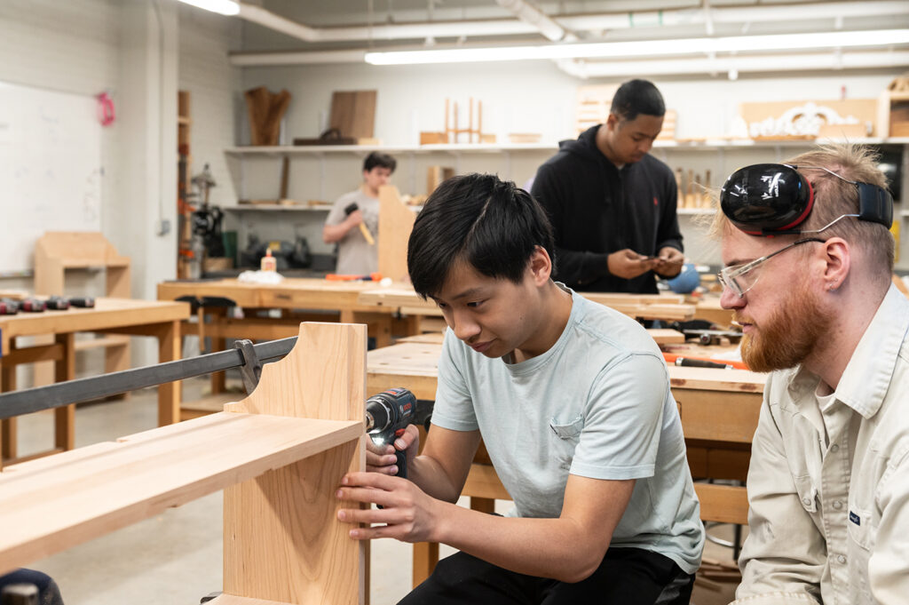 Woodworking Teen Intensive student working on their bookshelf