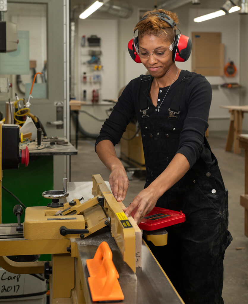 Carpentry student working on a jointer