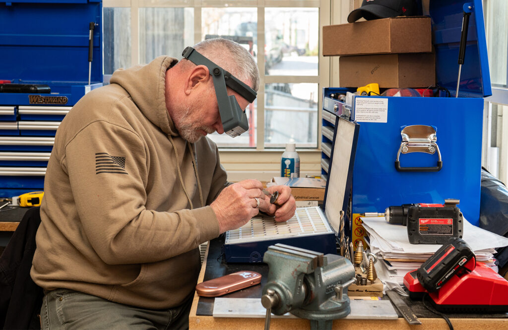 Locksmithing student working on a keying system